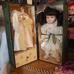 Antique doll with wooden wardrobe box